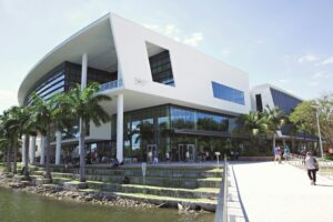 Contemporary architecture at the University of Miami campus with vibrant student life and lush surroundings.